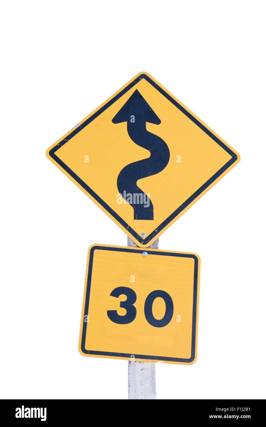 A Traffic sign warns of sharp  turns ahead and  speed  limit on a road Stock Photo