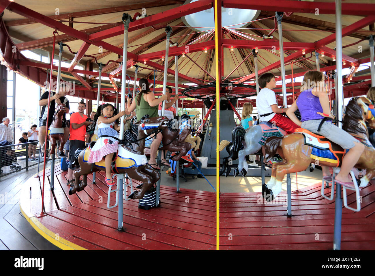 Asian child carousel ride hi-res stock photography and images - Alamy