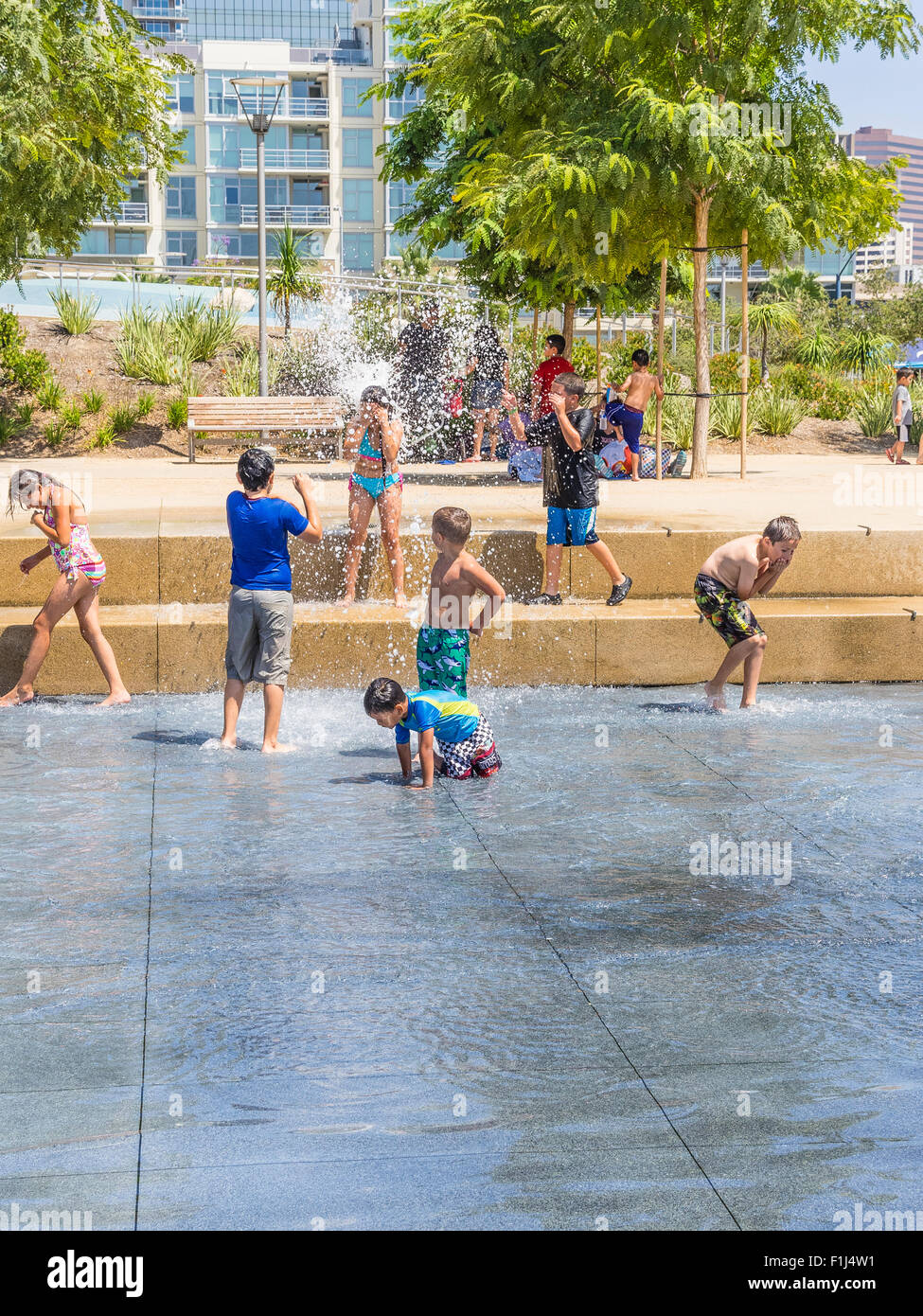 Children playing in water fountains at Waterfront Park, San Diego