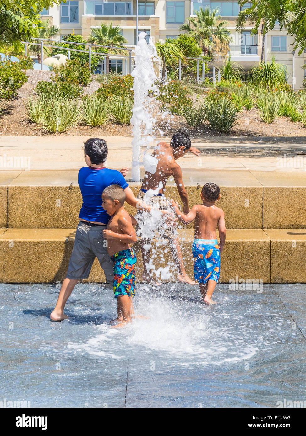 Children playing in water fountains at Waterfront Park, San Diego