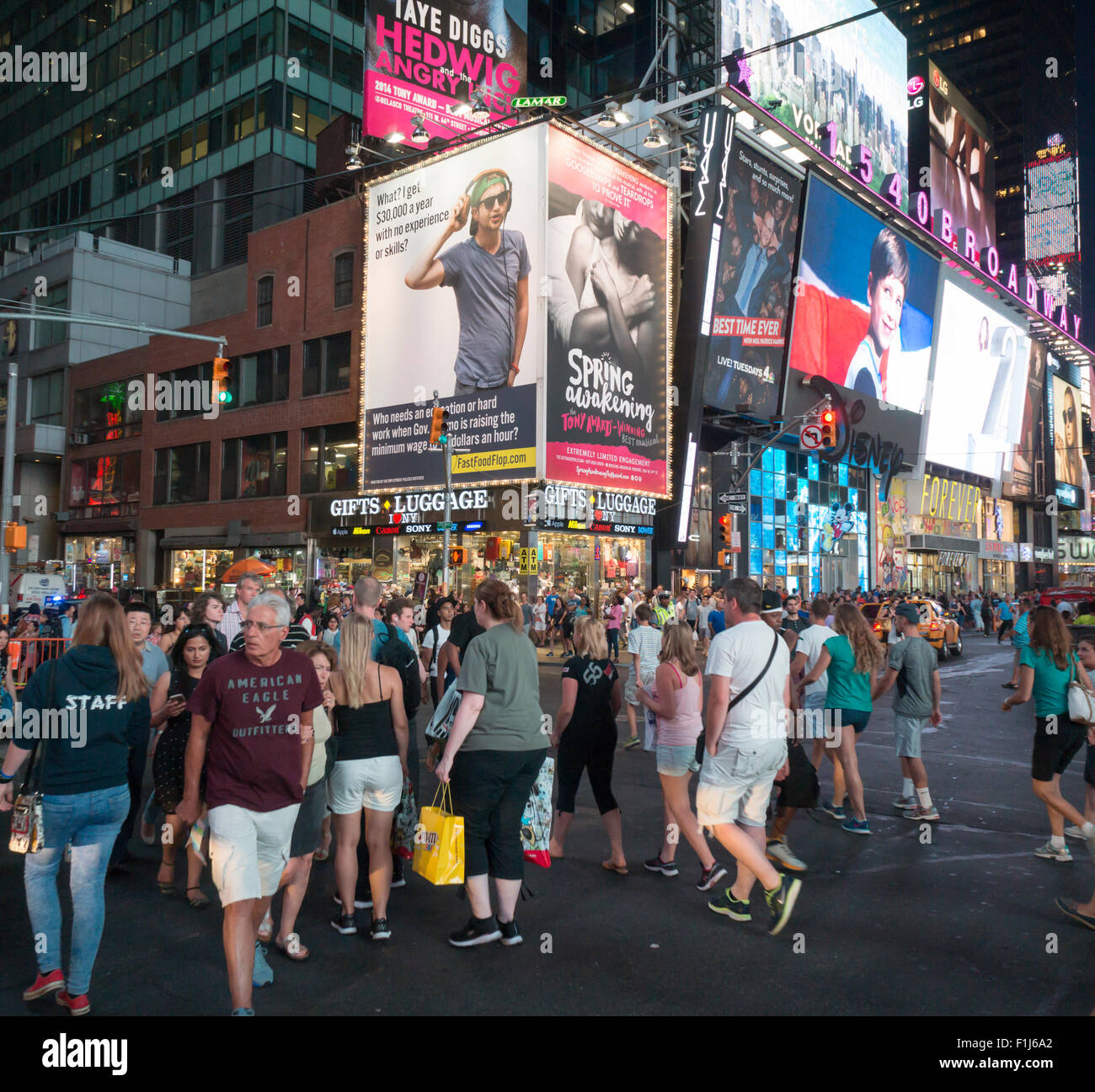 A billboard in Times Square in New York pokes fun at the push to raise the minimum wage to $15 per hour for fast food workers, seen on Wednesday, August 26, 2015. The advertisement is from the Employment Policies Institute and is part of their campaign entitled Fast Food Flop contending that the $15 wage devalues the work of employees who have worked hard to achieve that wage.  (© Richard B. Levine) Stock Photo