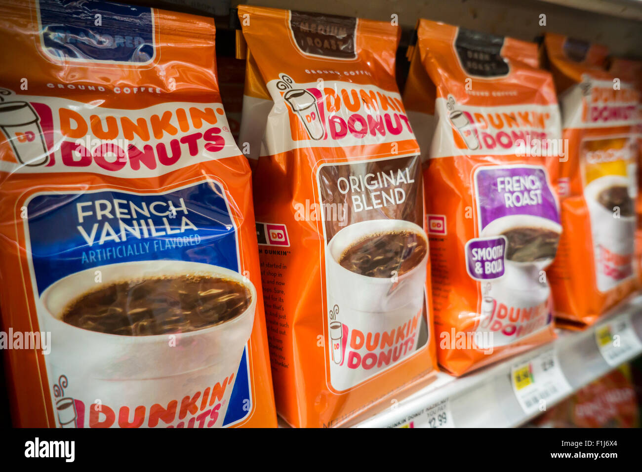 A display of Dunkin Donuts coffee on a supermarket shelf in New York on Saturday, August 29, 2015. J.M. Smucker Co. reported coffee business rose 12 percent for the first time in 11 quarters bringing up the company's overall results.  Smucker makes Folgers and the Dunkin Donuts brand coffees. (© Richard B. Levine) Stock Photo