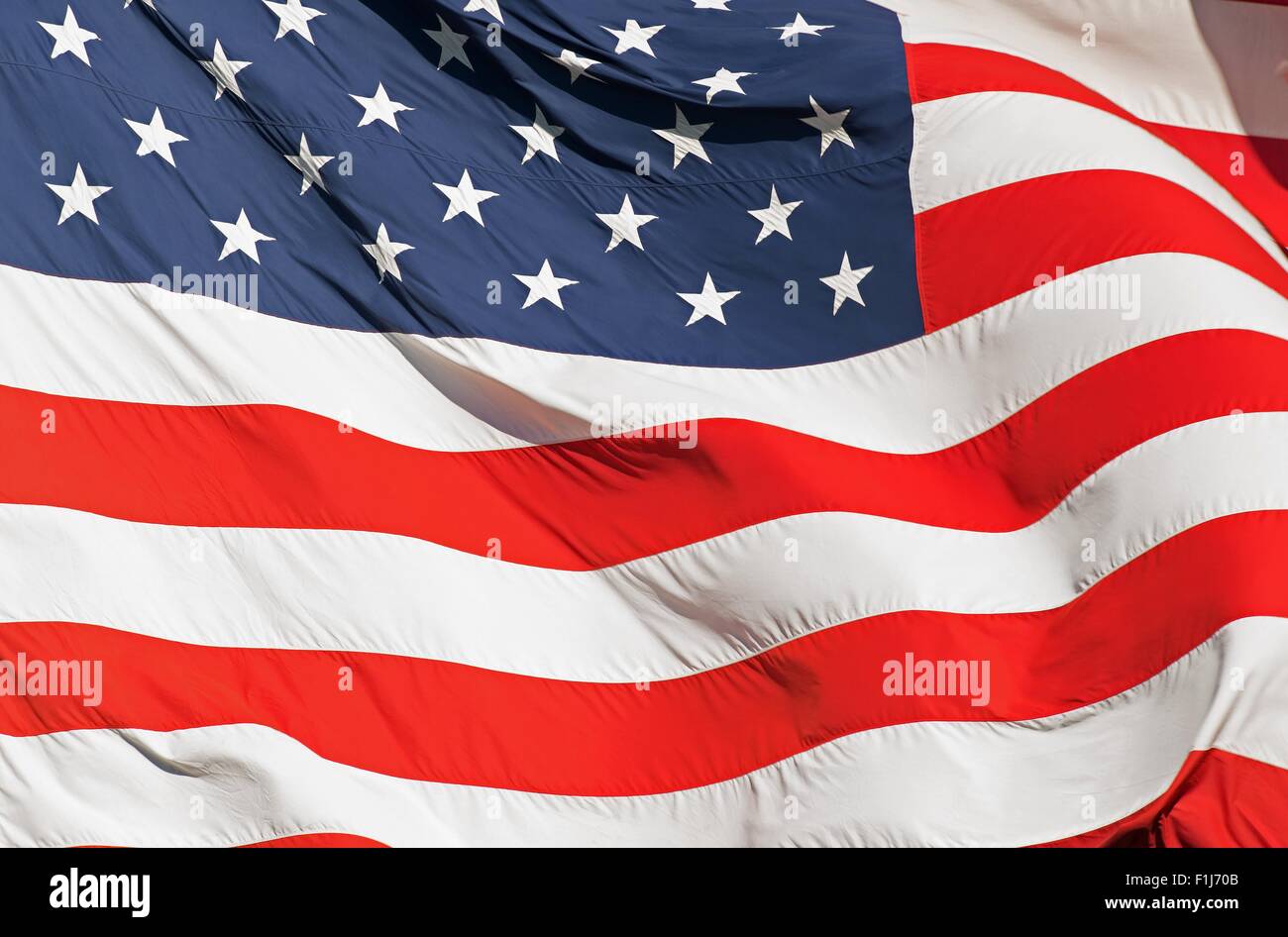 Waving Real Textile American Flag Closeup Photography. United States of America Nation Flag. Stock Photo