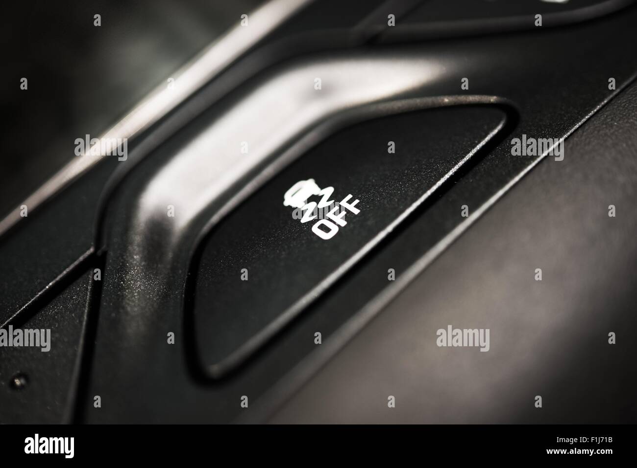 Traction Control Off Button Closeup. Traction Control in Car System. Safety Car Feature. Stock Photo