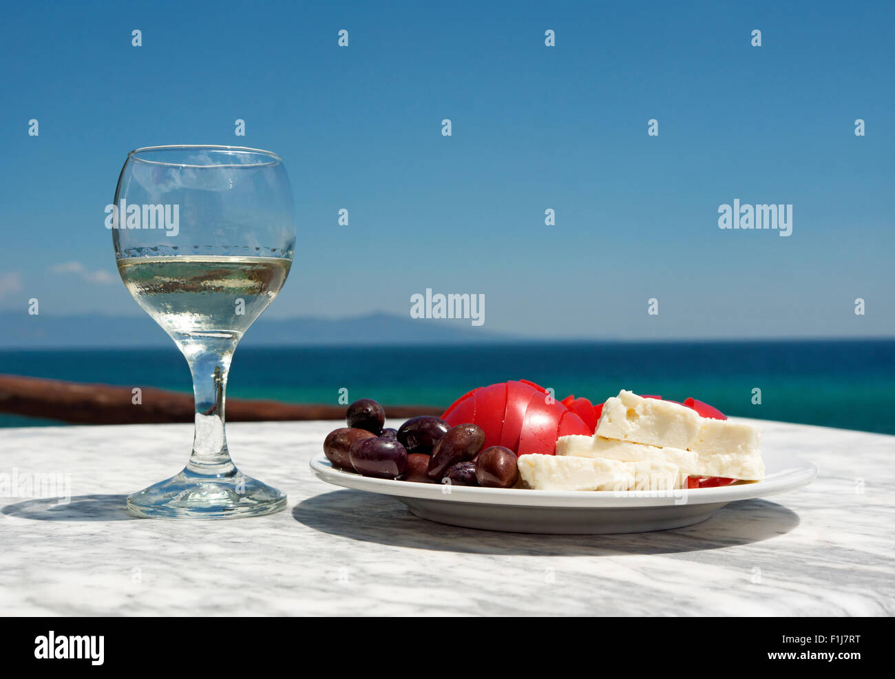 Appetizer and salad on the sea background Stock Photo