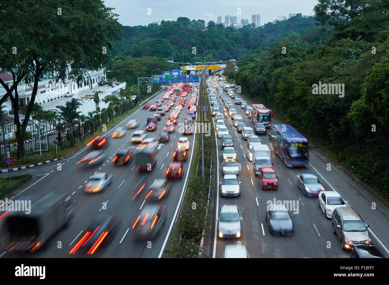 Evening traffic on the left driving road in Malaysia Stock Photo