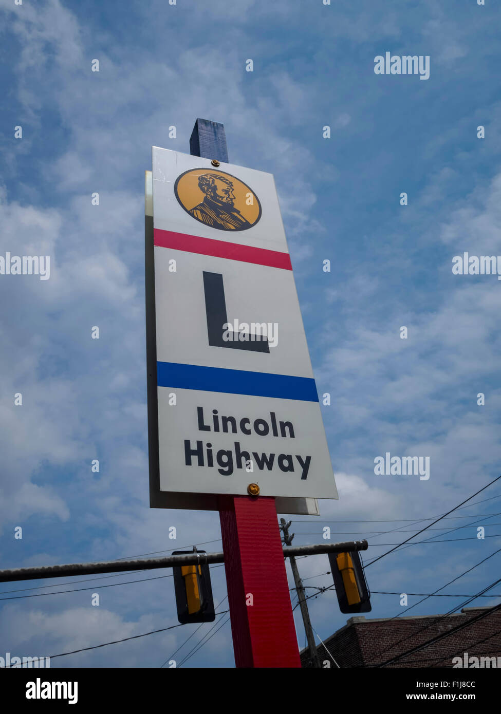 Close up view of a sign in Bedford, Pennsylvania denoting the scenic Lincoln Highway. The Lincoln Highway Association was created in 1913 to promote a nearly 3400 mile-long paved road stretching from New York to San Francisco to encourage motor travel, pre-dating numbered US routes built by the United States federal government starting in the 1920s. Taken summer 2015. Stock Photo
