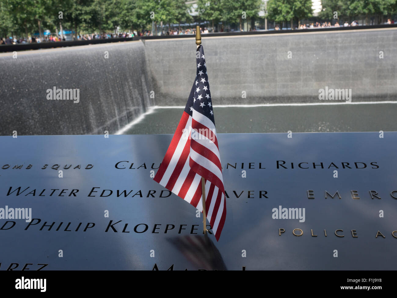 A U.S. flag placed next to a name at the Sept. 11 Memorial in Lower Manhattan, New York City. Stock Photo