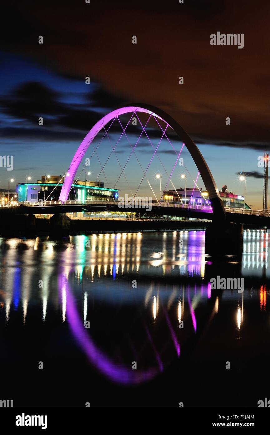 Glasgow, Scotland, UK. 02nd Sep, 2015. The Clyde Arc, also known as the Squinty Bridge, is lit up as night falls with STV and BBC offices in the background and the lights reflecting on the River Clyde Credit:  Tony Clerkson/Alamy Live News Stock Photo