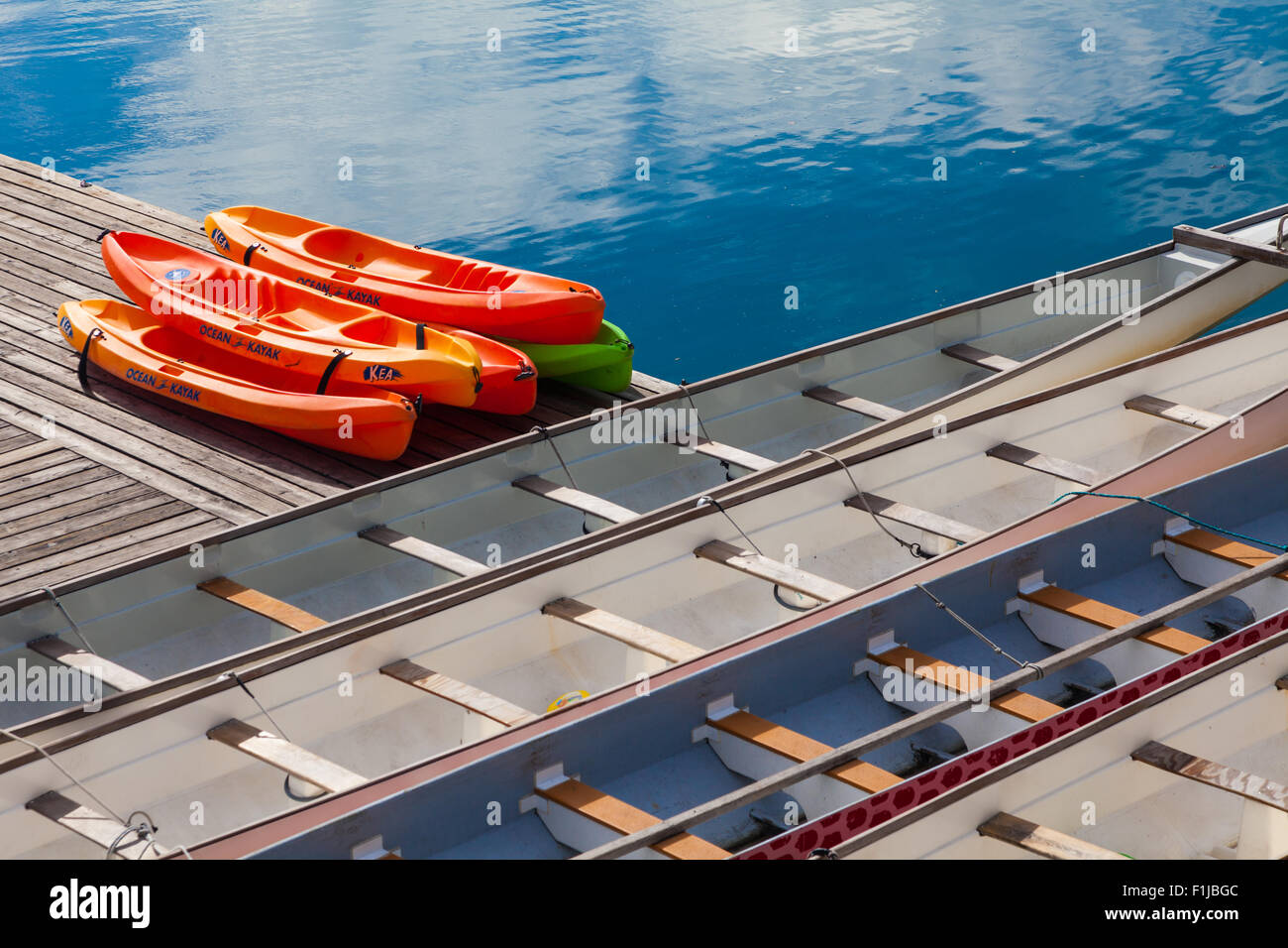 Dragon Boats and Kayaks at a dock in False Creek, Vancouver, British Columbia Stock Photo