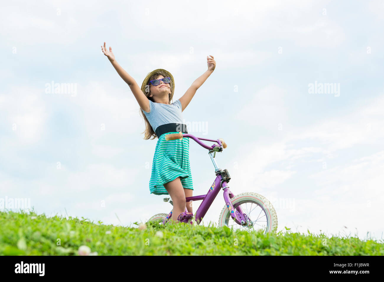 Beautiful portrait of a little girl outside on grass Stock Photo - Alamy