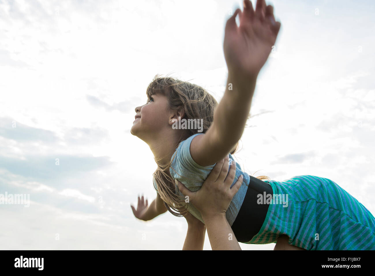 Beautiful portrait of a little girl outside on grass Stock Photo - Alamy
