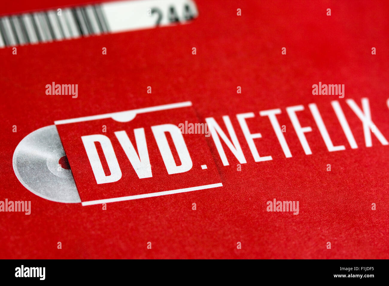 NETFLIX logo on red envelope used for returning a rented DVD by mail with sleeve barcode visible at upper left Stock Photo
