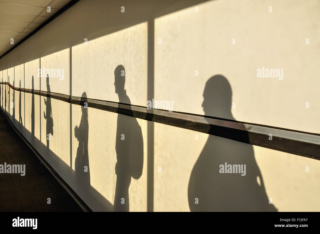 Shadows of passengers queueing for aircraft in O.R.Tambo International Airport, Johannesburg, Gauteng, Republic of South Africa Stock Photo