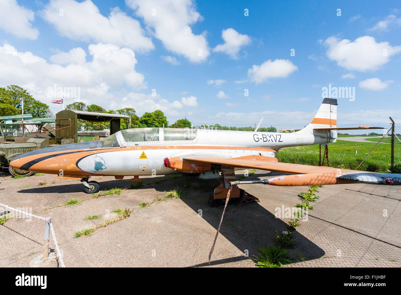 Manston airport museum. PZL Mielec TS-11 Iskra, a Polish jet trainer, on concrete airport apron in bright sunshine. Stock Photo