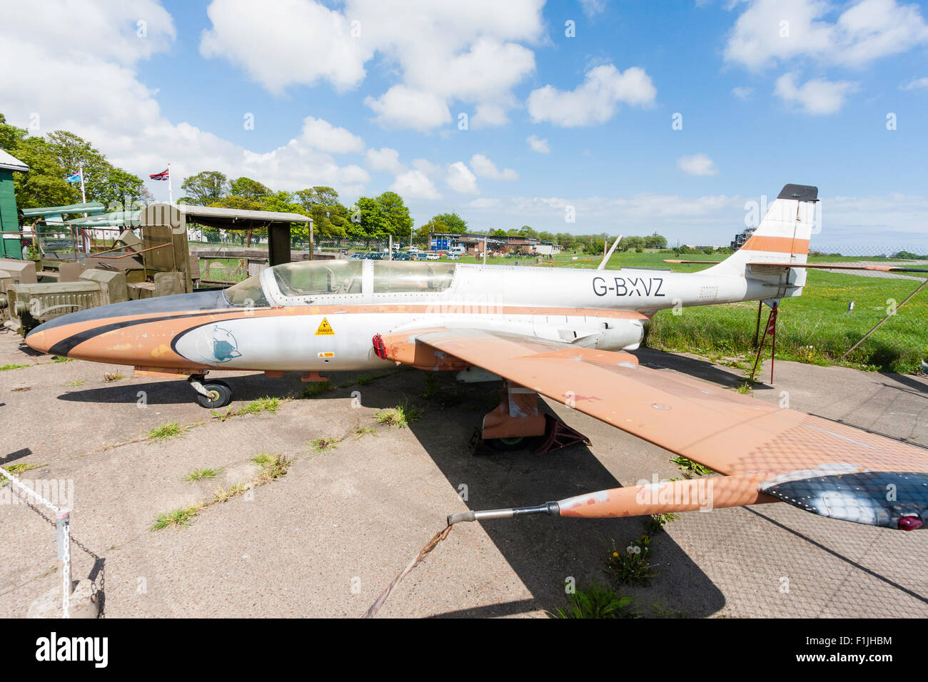 Manston airport museum. PZL Mielec TS-11 Iskra, a Polish jet trainer, on concrete airport apron in bright sunshine. Stock Photo