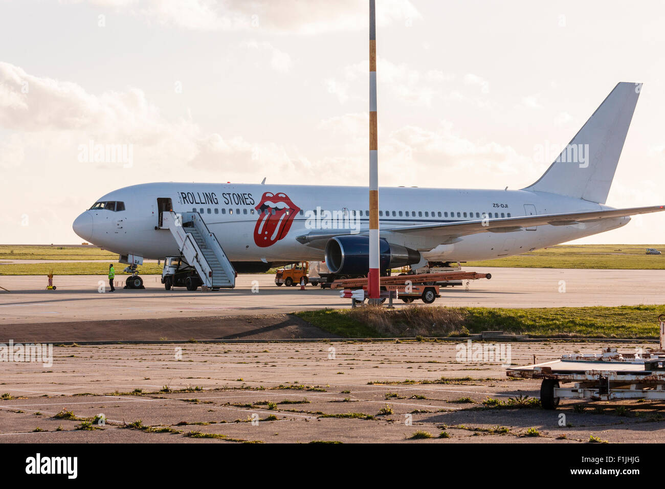 England, Manston airport. Rock and roll band, the Rolling stones Boeing 767, with lips and tongue logo on side in red, parked on apron with airstair. Stock Photo