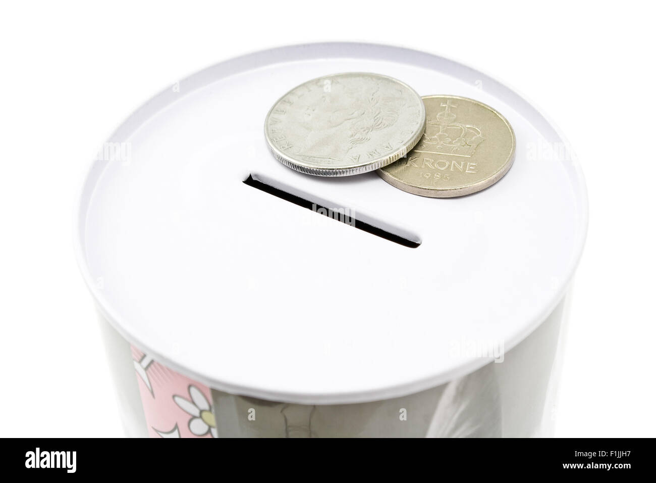 Tin money box with coins isolated on white Stock Photo Alamy