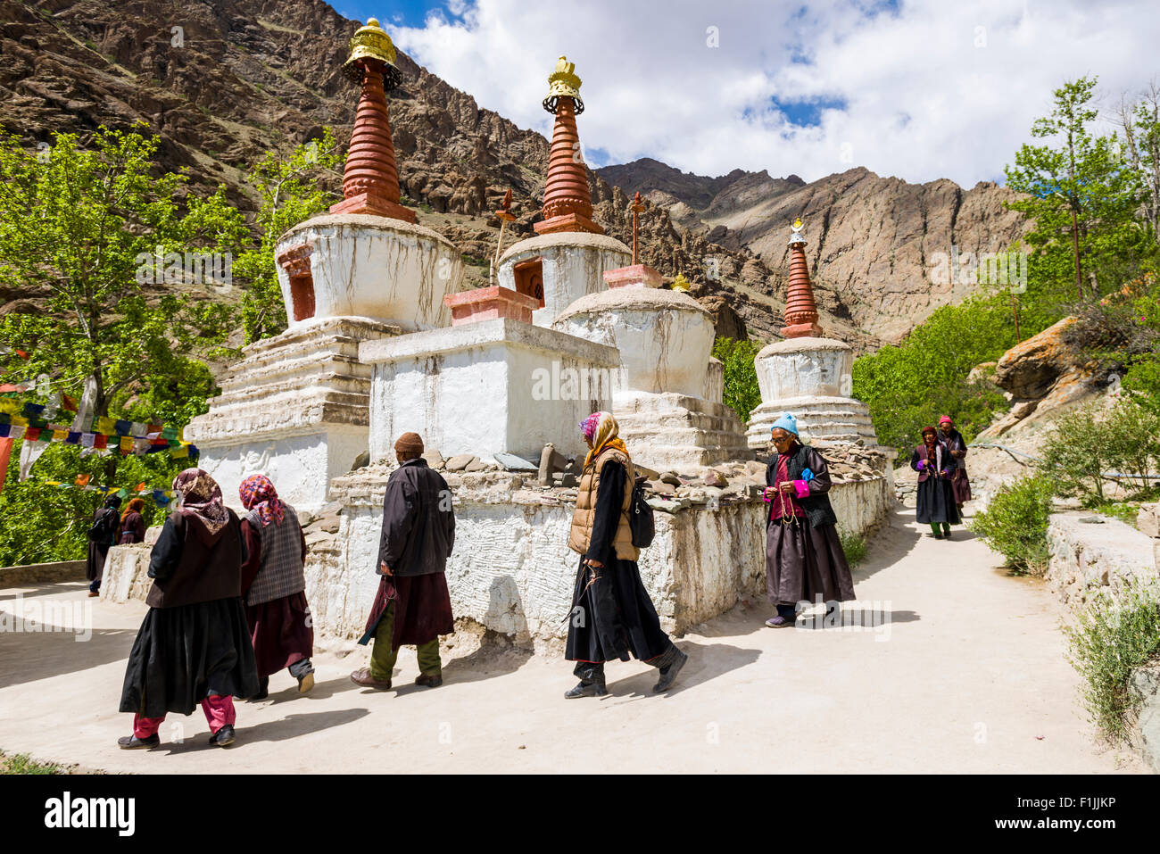 Local pilgrims are walking around a Chorten in a small valley above Hemis Gompa, Hemis, Jammu and Kashmir, India Stock Photo