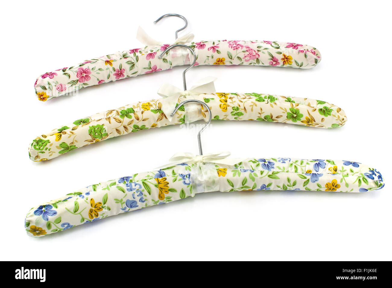 Colorful silk clothes hangers on white Stock Photo