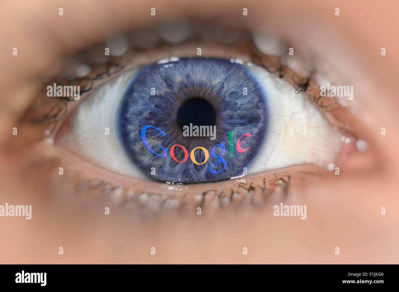 Blue eye with the Google logo on iris, symbolic image, data security Stock Photo
