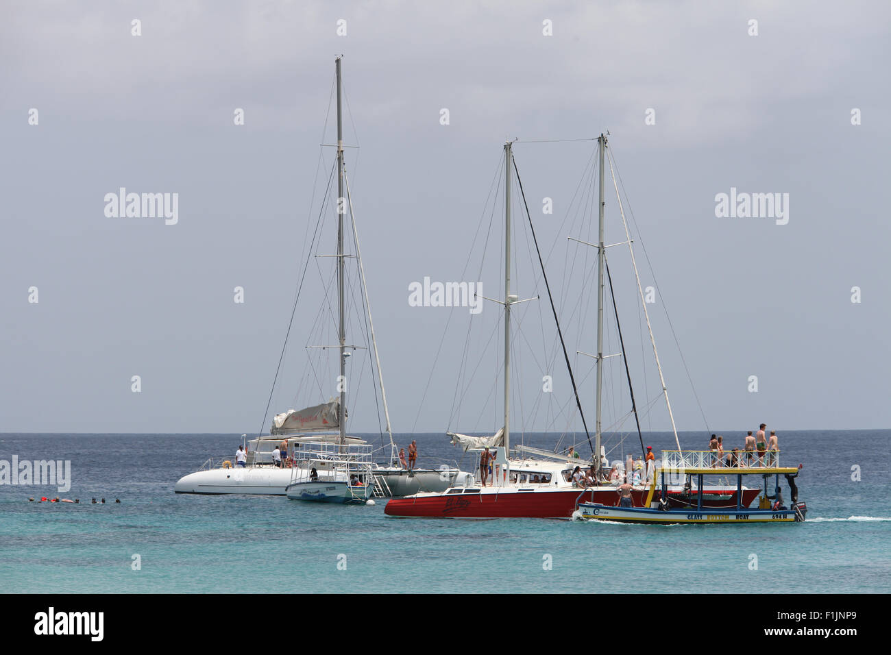 Tourists on boats snorkeling over a ship wreck on the West Coast of Barbados . Stock Photo
