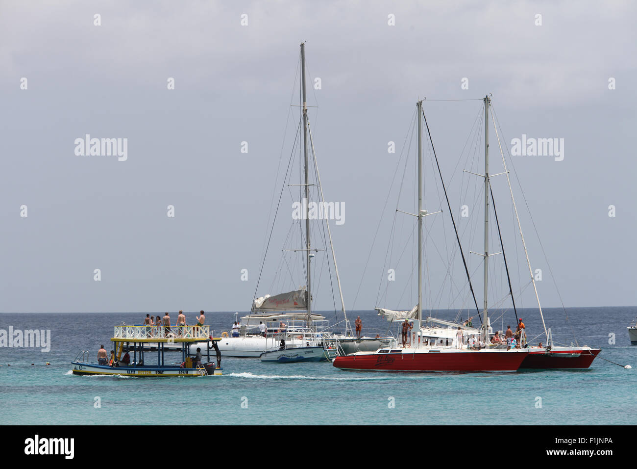 Tourists on boats snorkeling over a ship wreck on the West Coast of Barbados . Stock Photo