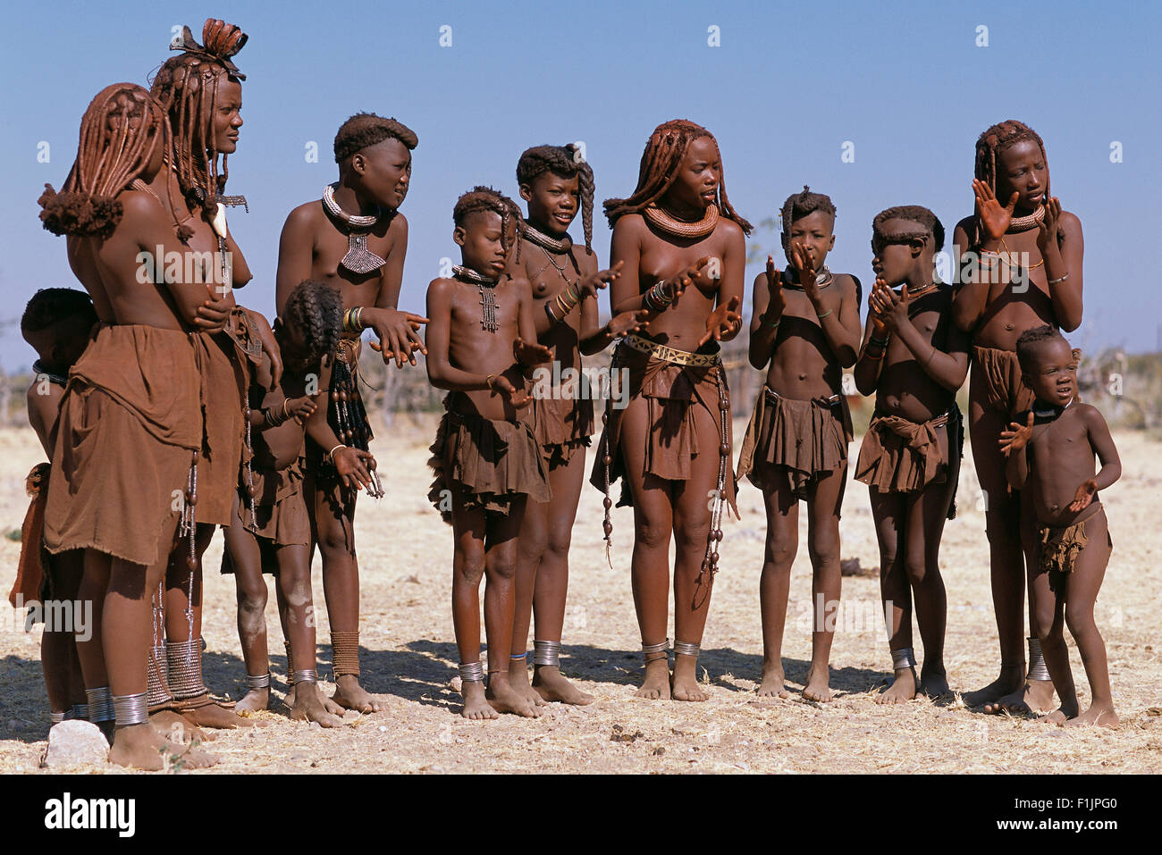 Himba Tribe Clapping Hands, Namibia, Africa Stock Photo