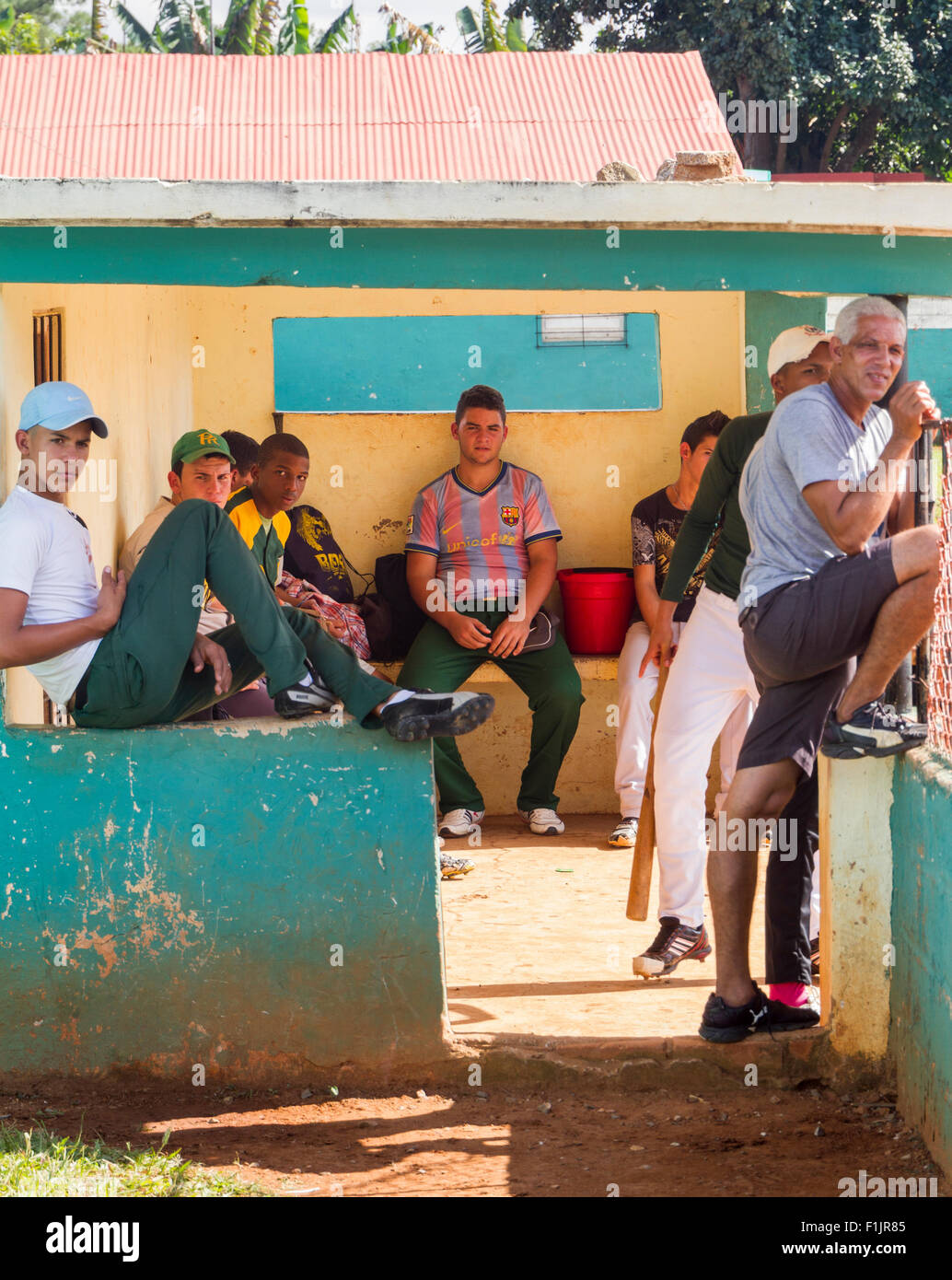 Young men watching the local game of baseball in Vinales, Cuba Stock Photo