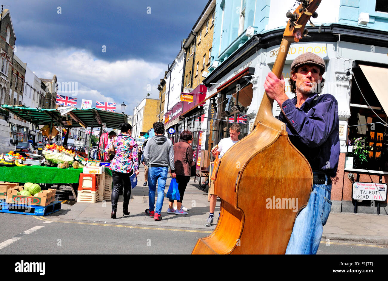 London, England, UK. Portobello Road - busker playing the double bass Stock Photo