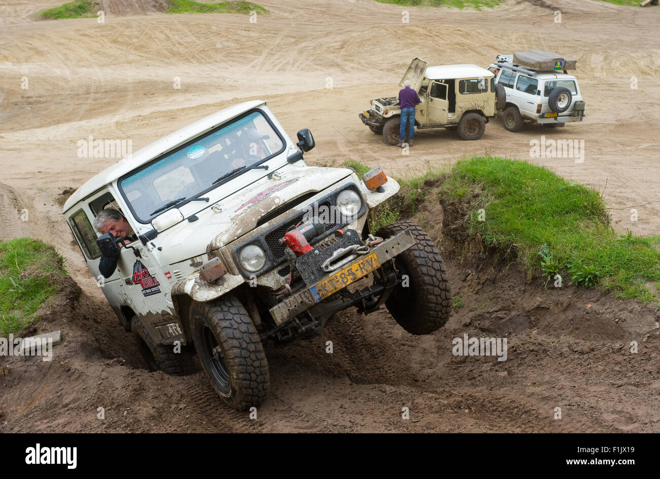A Toyota 4wheel drive is driving on a special off the road terrain for land cruisers and