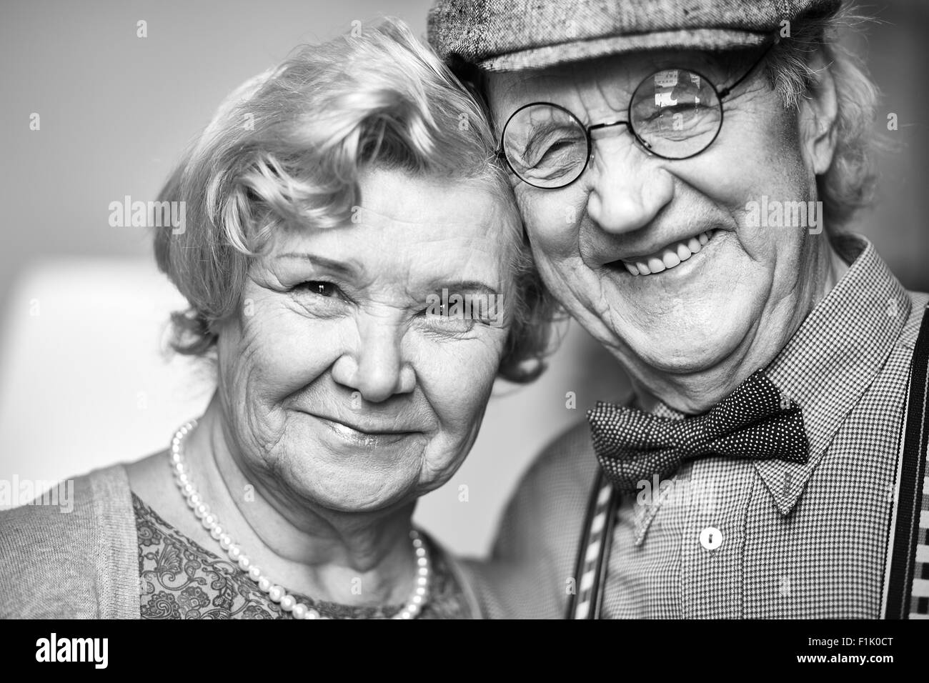 Retired couple looking at camera Stock Photo