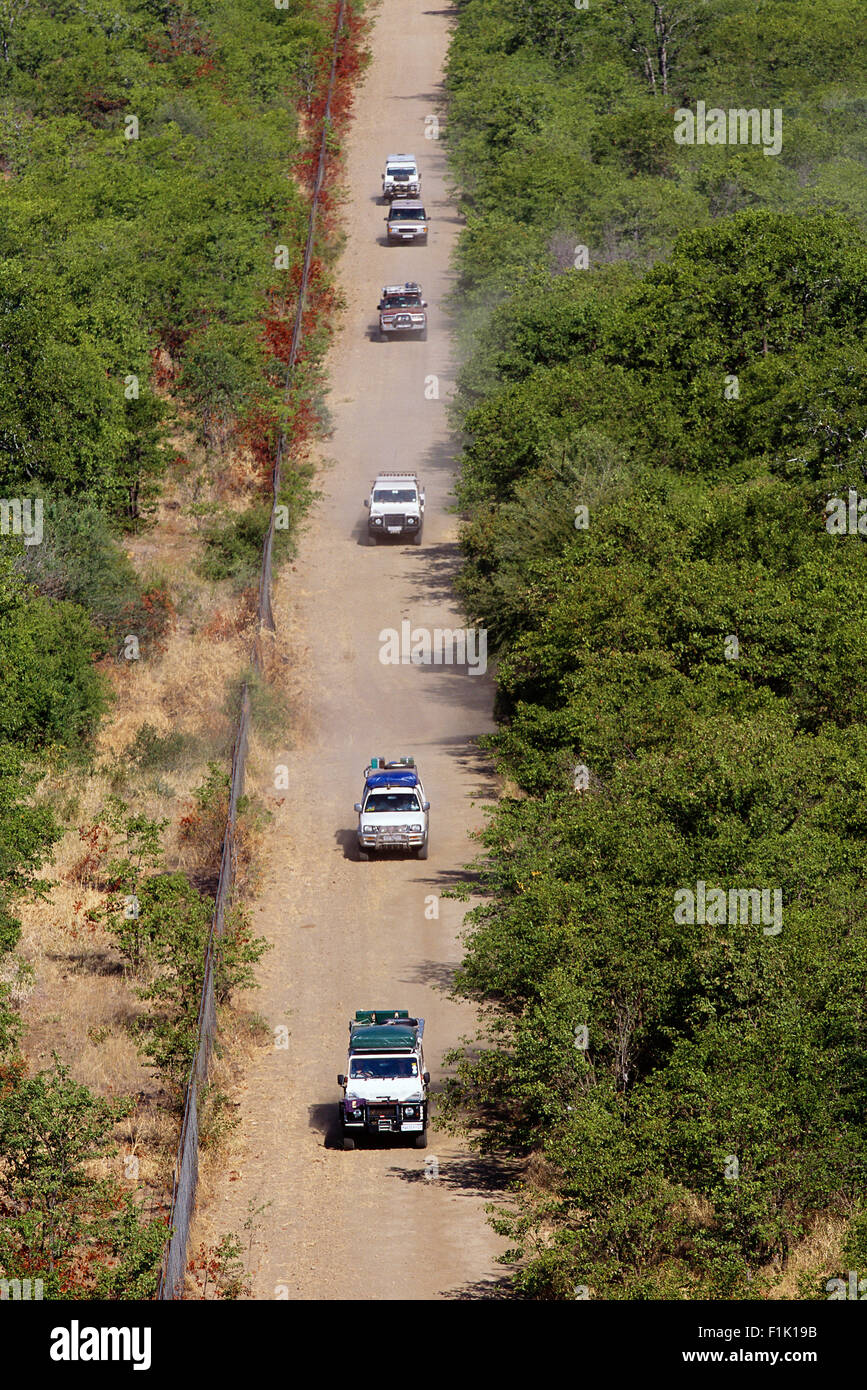 Aerial View of Safari Vehicles On Dirt Road Kruger National Park Mpumalanga, South Africa Stock Photo