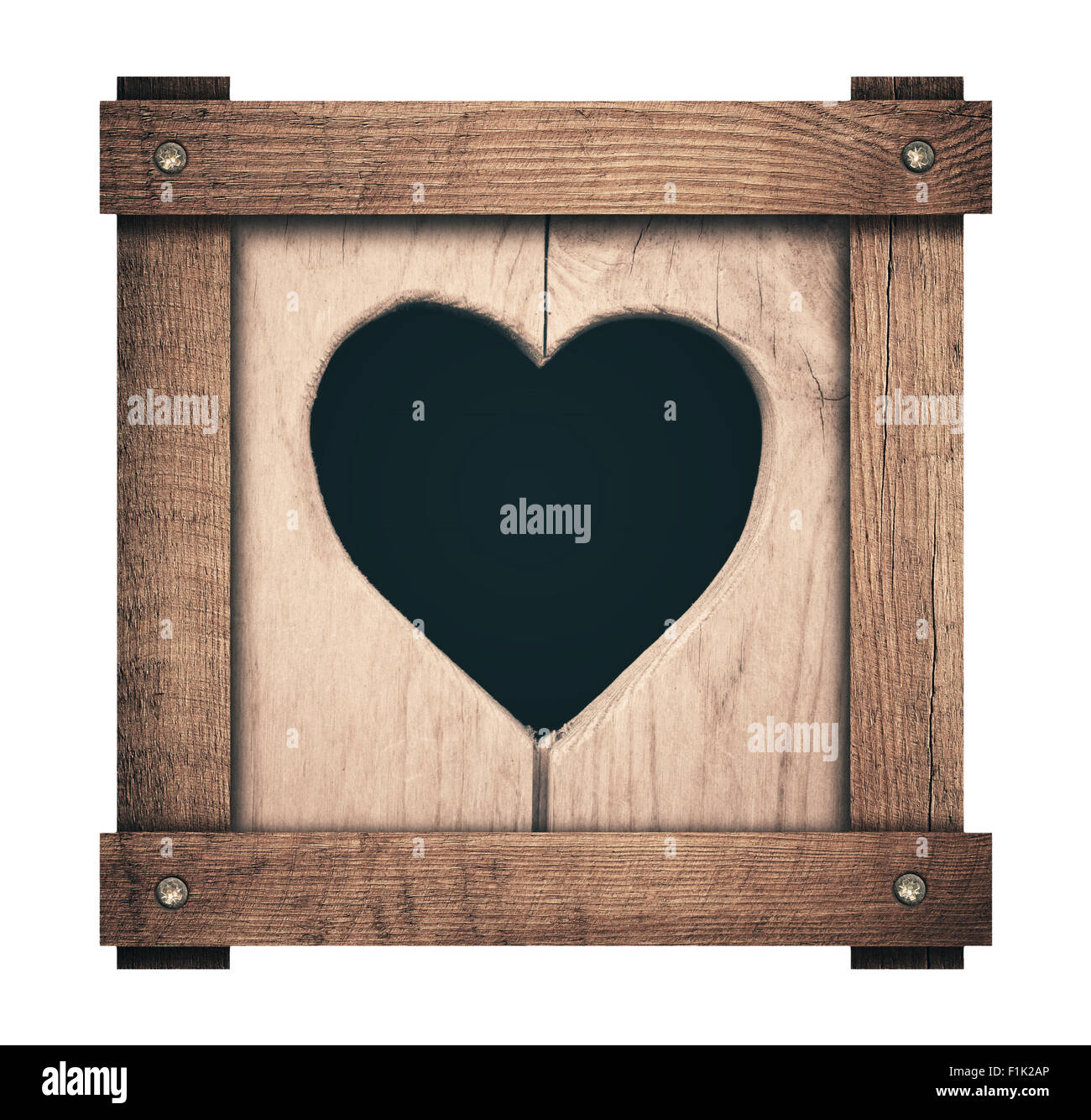 Heart shape cut on wooden planks and screwed frame Stock Photo