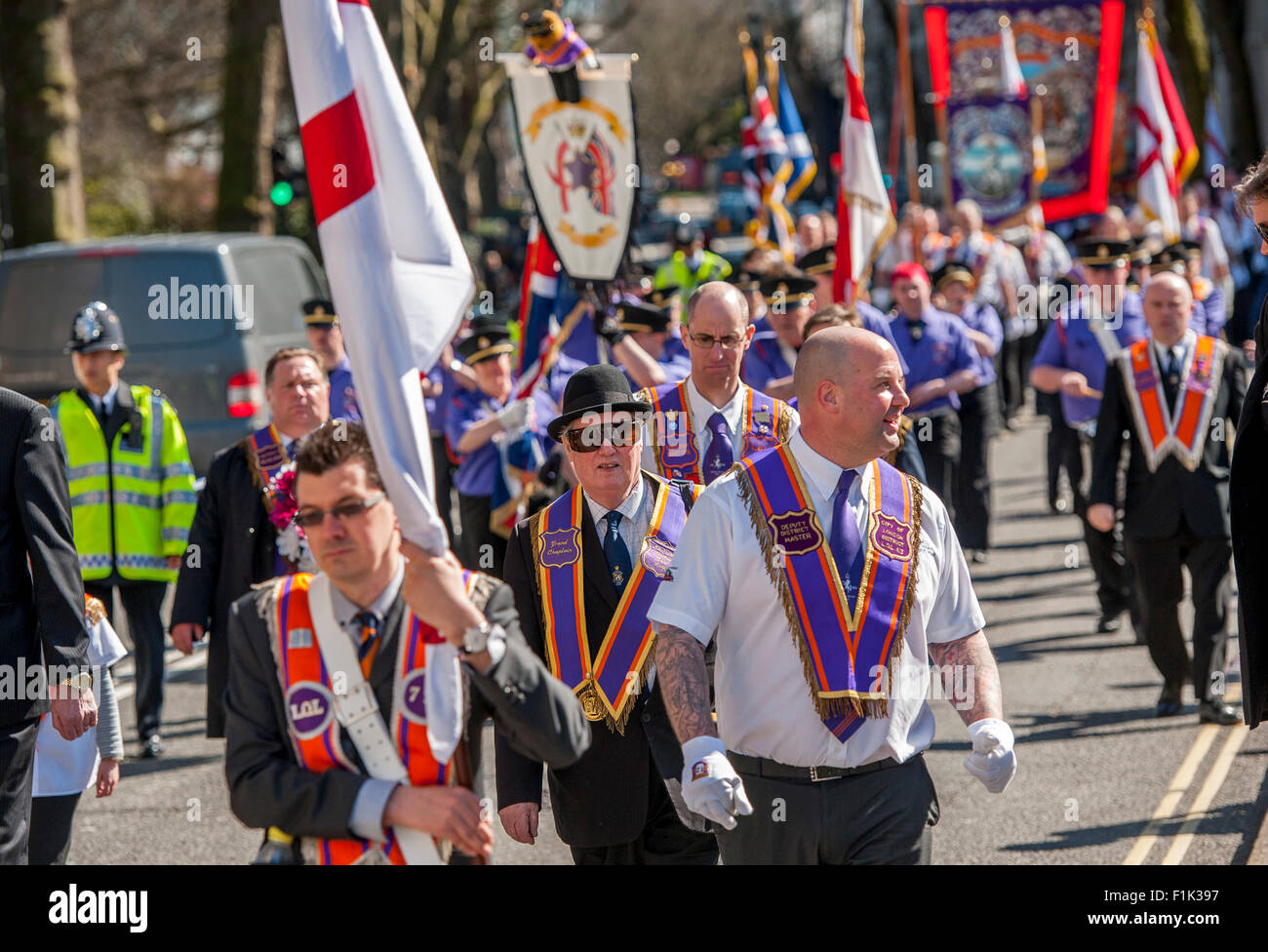 St Day Orange parade in City of London being escorted by the