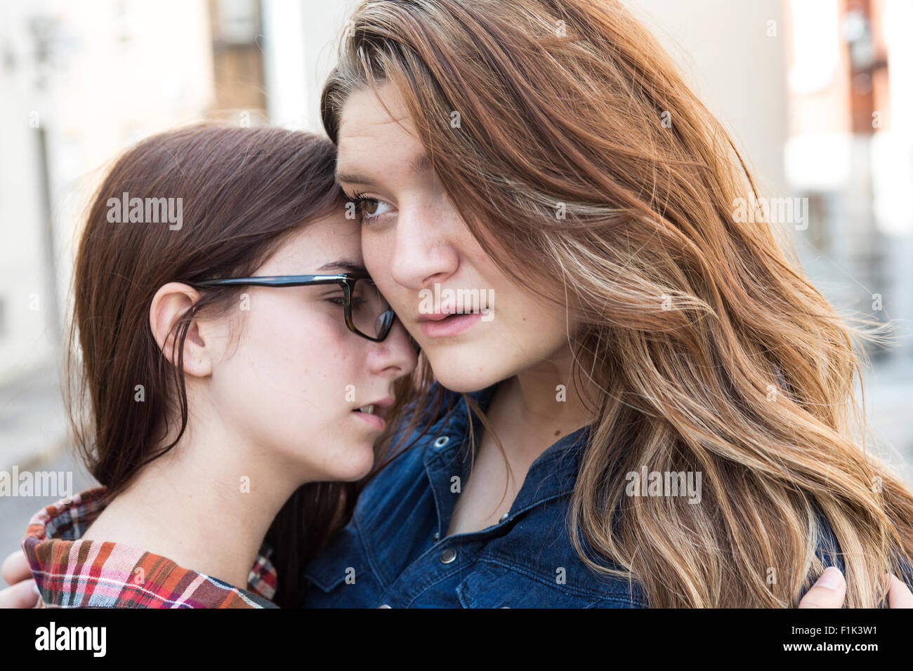 Woman comforting a sad caucasian girl Stock Photo - Alamy