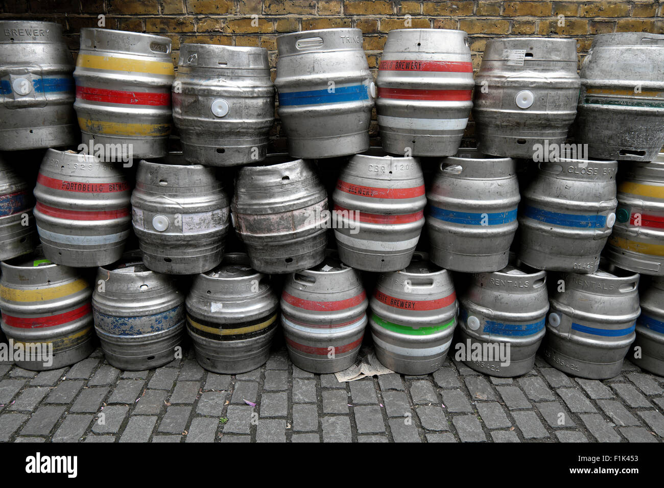 Empty beer barrels kegs outside a pub in Bermondsey South London UK