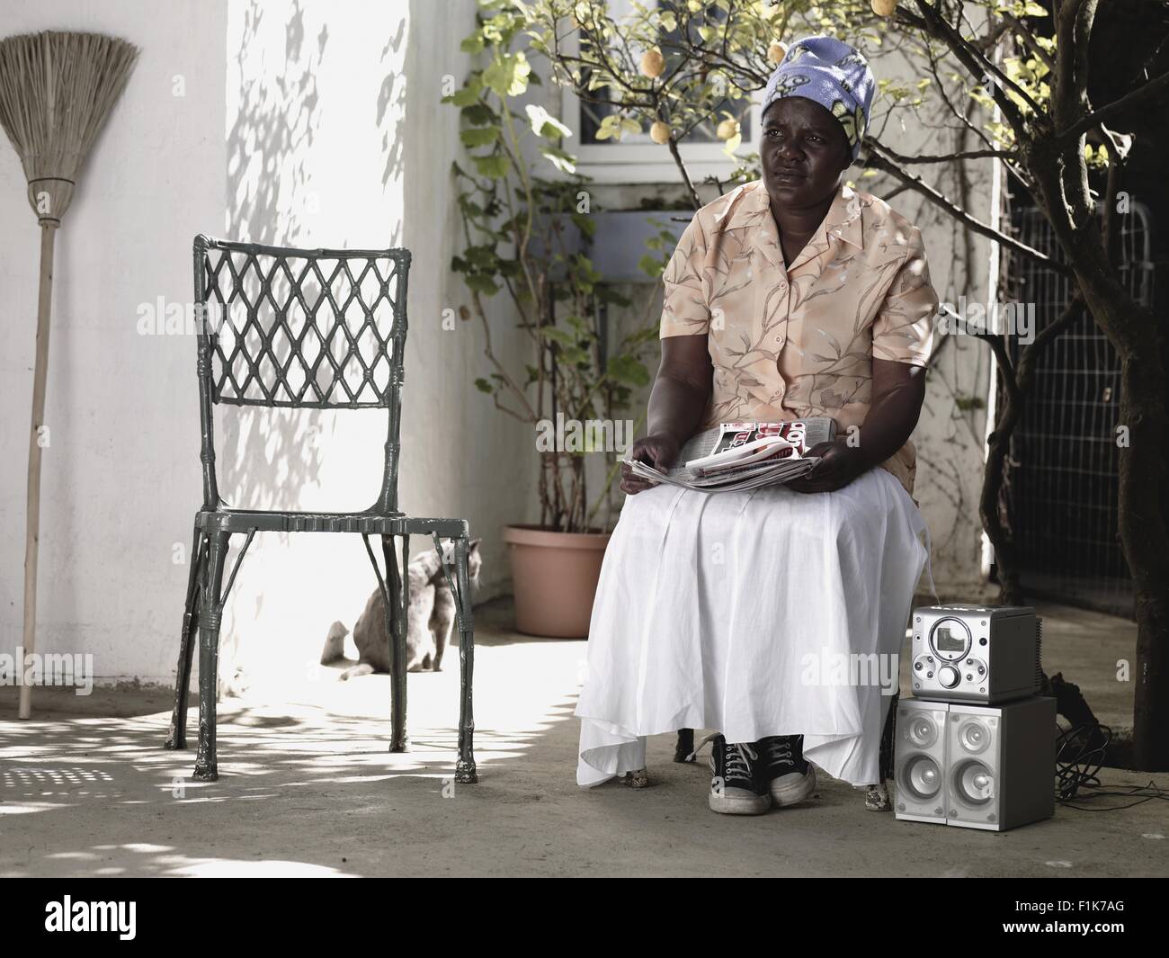 Woman on veranda hi-res stock photography and images - Alamy