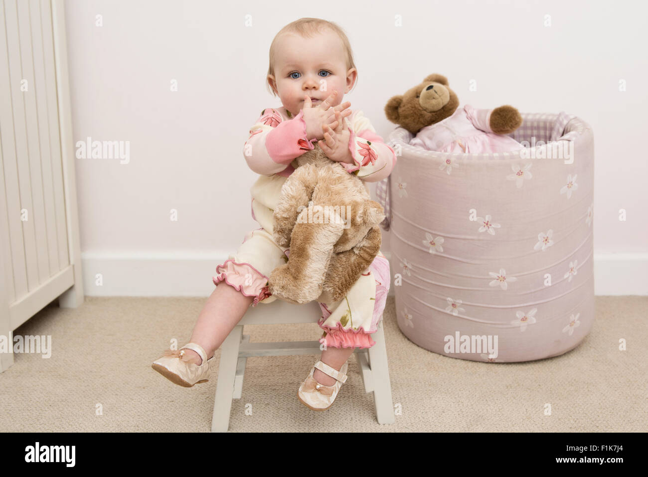 Girl on stool hi-res stock photography and images - Alamy