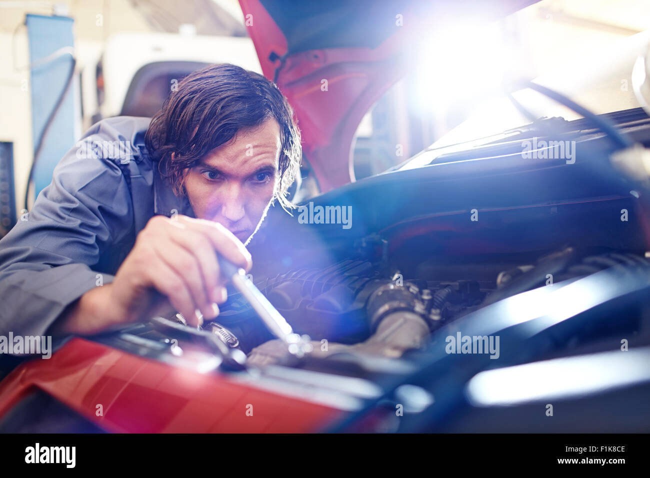 Mechanic working on car engine hires stock photography and images Alamy