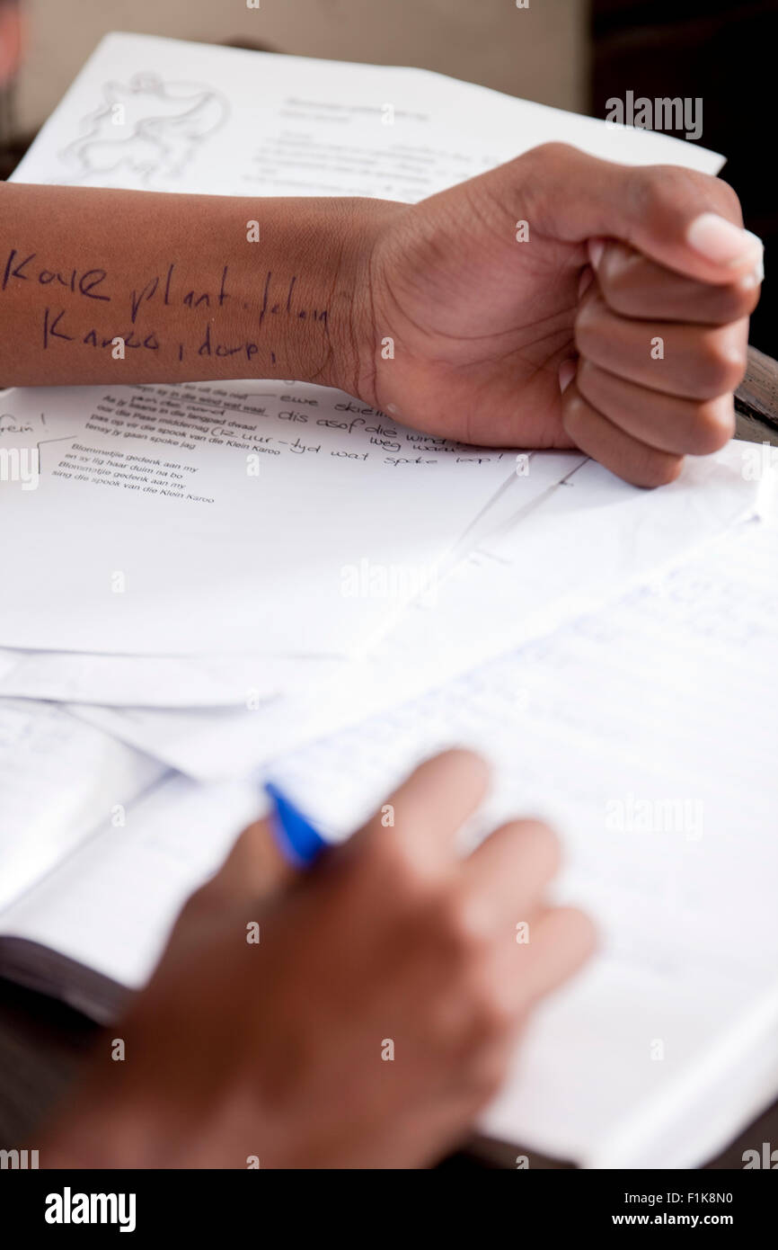 A male student cheats on a test Stock Photo
