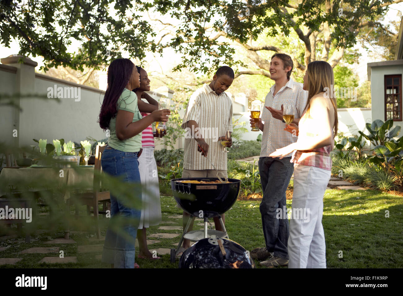 Multicultural group of friends having a braai/barbecue, South Africa