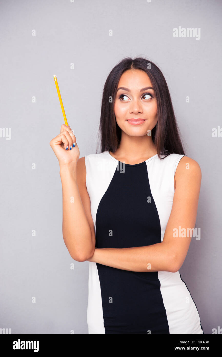 Woman thinking holding pencil hi-res stock photography and images - Alamy