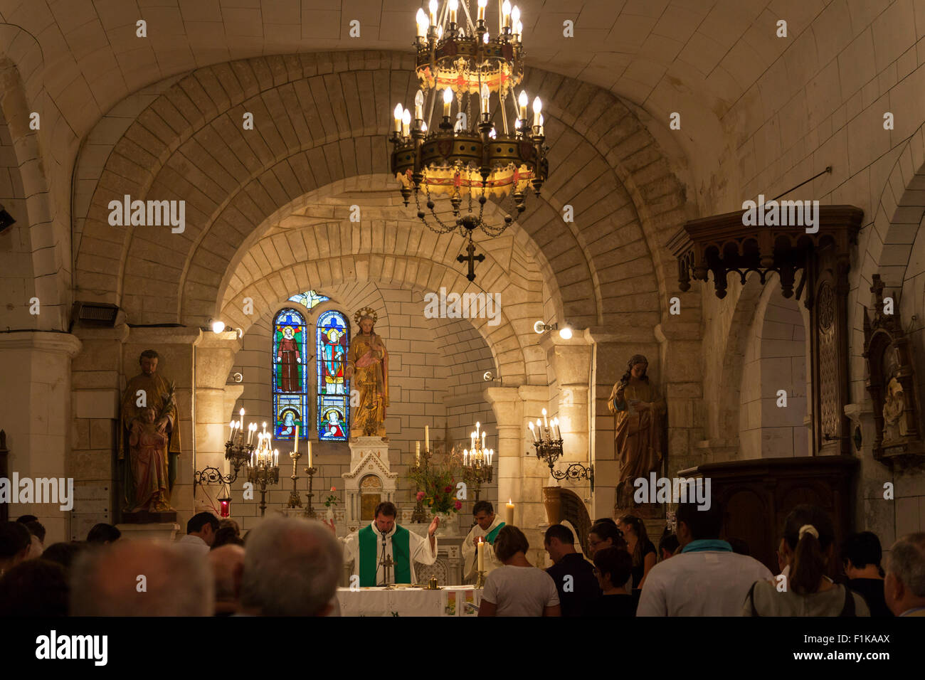Catholic mass at the church of St. Cybardeaux, Charente Maritime, south west France Stock Photo