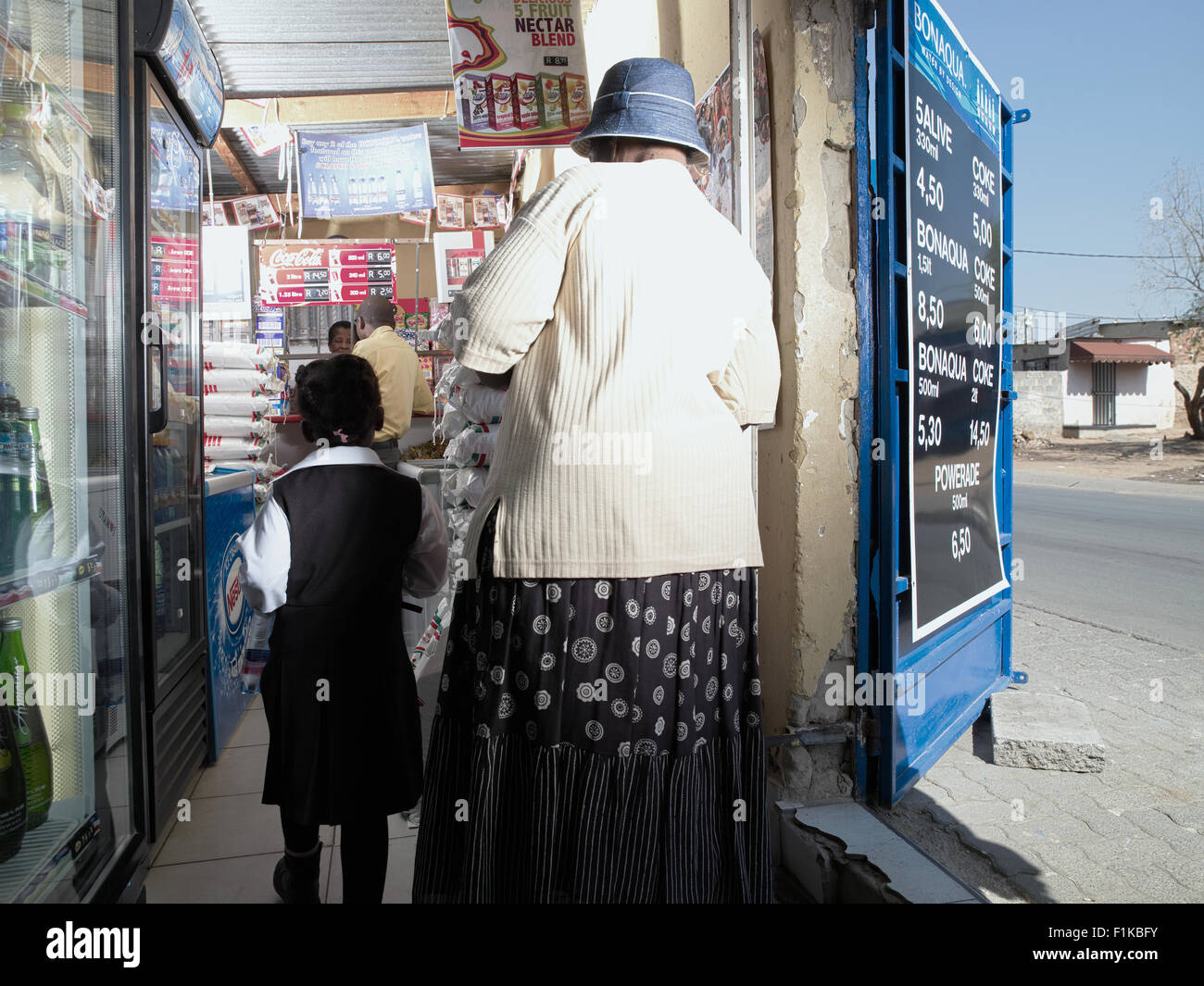 Customers in township spaza shop, Alexandra, Gauteng, South Africa Stock Photo