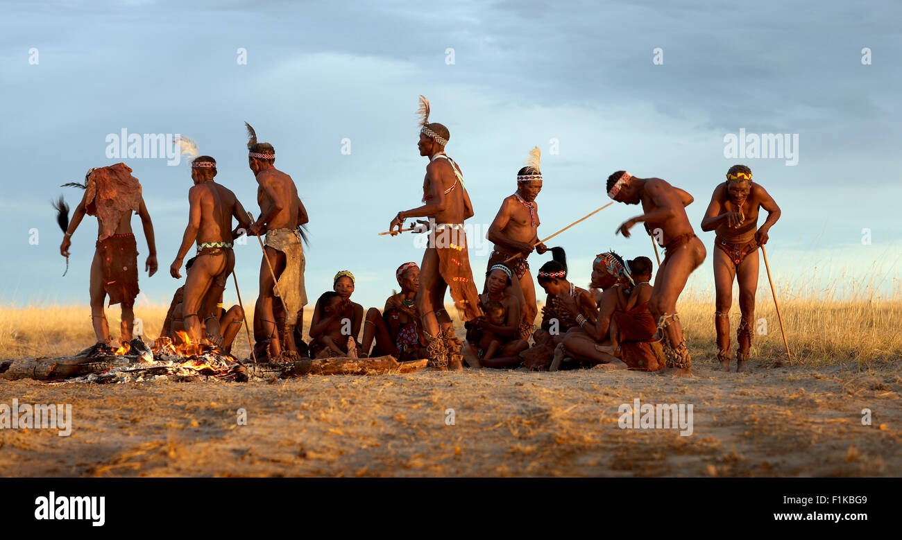 Bushmen by campfire Stock Photo