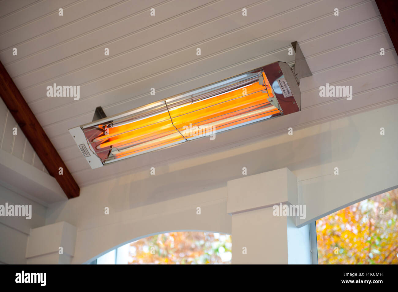 Infrared heater in a screened porch to the room in cooler months Stock Photo