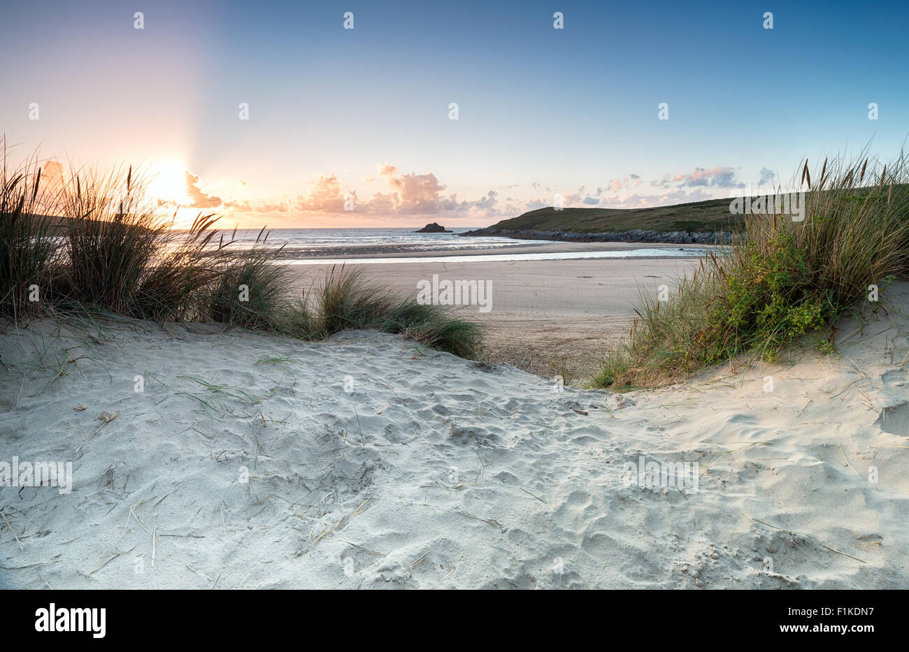 Sunset through the sand dunes at Crantock beach near Newquay in Cornwall Stock Photo