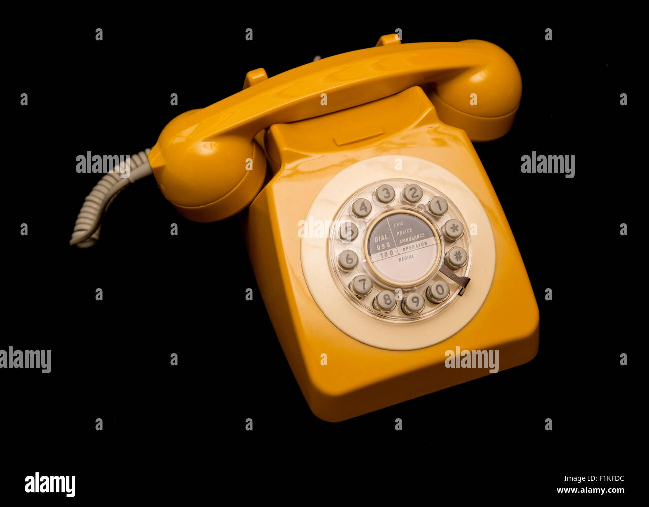 mustard retro style telephone cutout Stock Photo