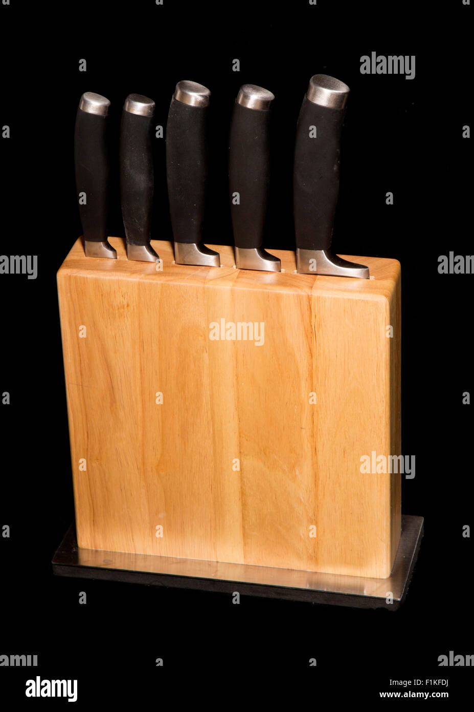 set of knives in a block cutout Stock Photo